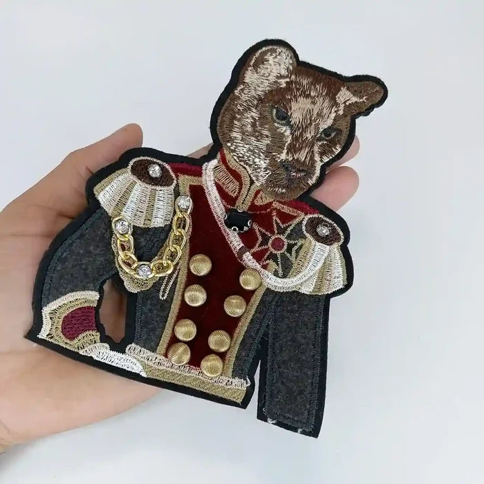 Feline Officer Sew Patch by Ani Accessories in hand, showing embroidered applique details up close