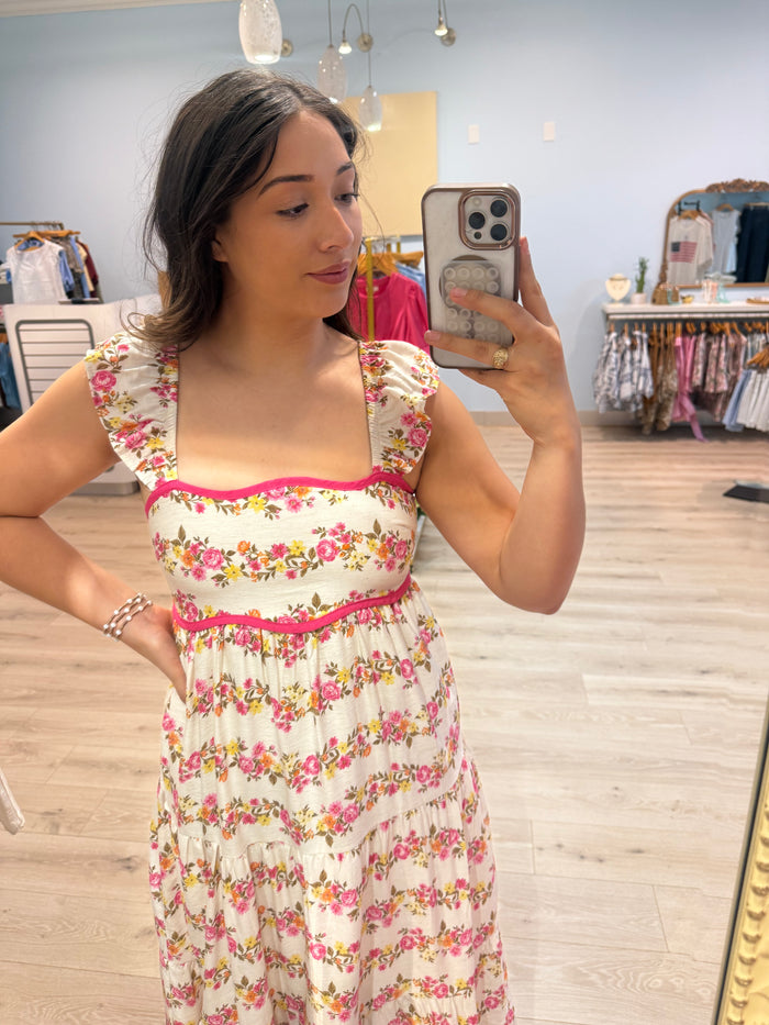 maxi dress with pink trim and florals