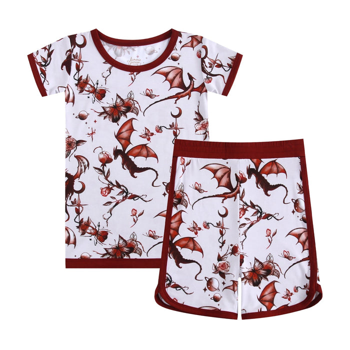 The Jammie Session Dreaming with Dragons Short Pajama Set features soft, breathable bamboo with maroon trim and a whimsical dragon and flower print‚Äîstylish comfort for playful days or cozy nights.