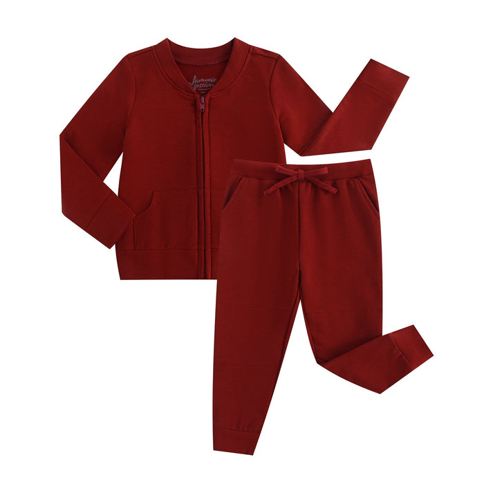 The Jammie Session Dreaming with Dragons Solid Kids' Jacket (runs small, please size up) pairs with drawstring pants for a matching children‚Äôs set. This hypoallergenic, long-sleeve zip-up jacket in dark red offers comfort and everyday style.