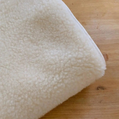 Protège matelas en laine vierge Sassoupi - 70x140cm